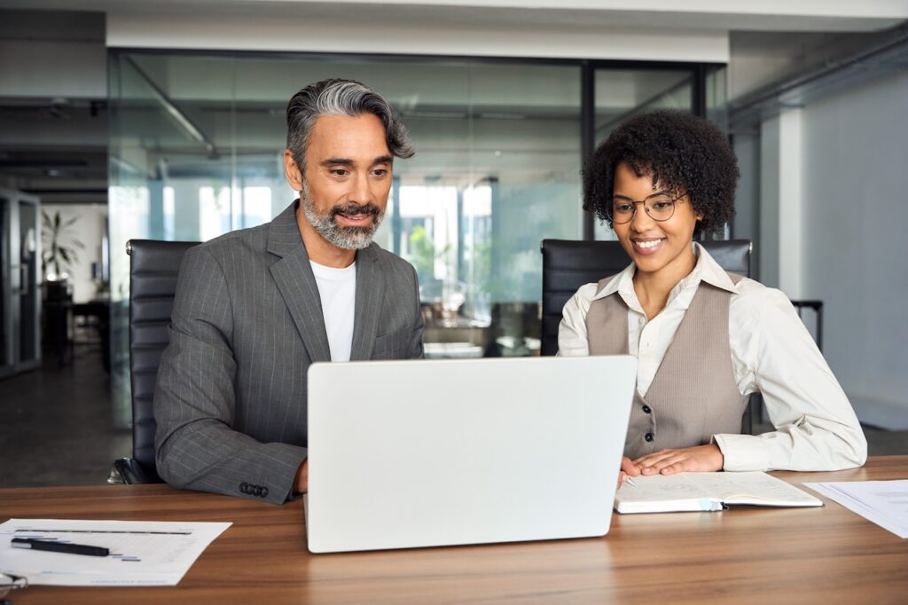 coworkers working in office on computer